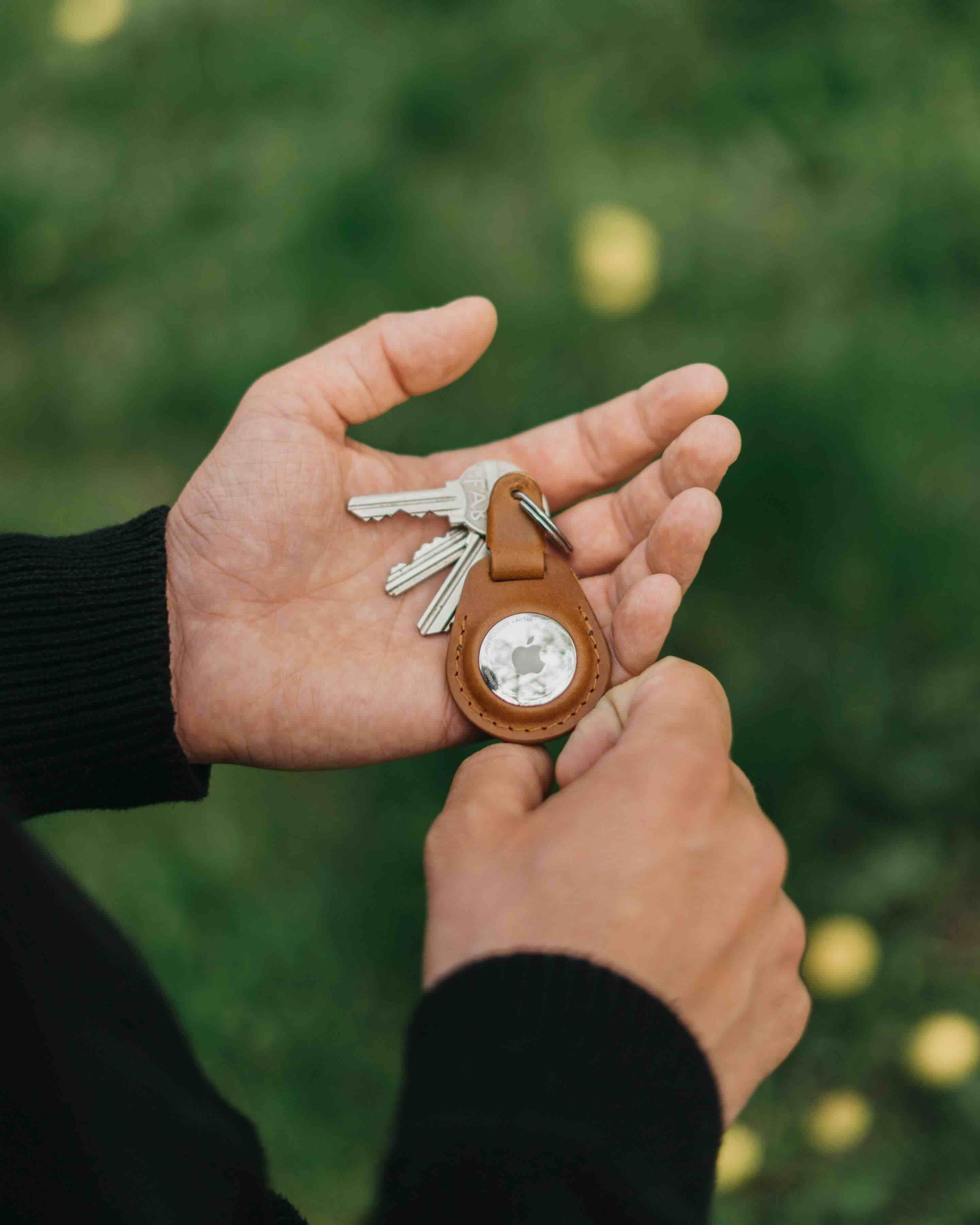 Apple AirTag Collection picture - holder in hands lifestyle picture