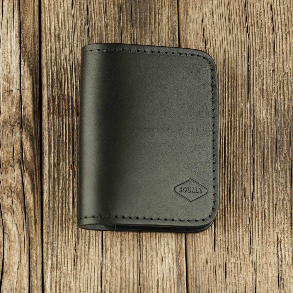 Black leather bifold wallet with slot on Apple AirTag front view