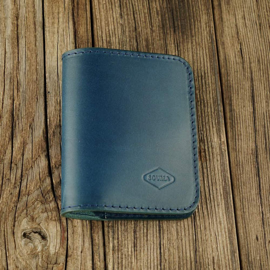 Blue leather bifold wallet with slot on Apple AirTag slot front view