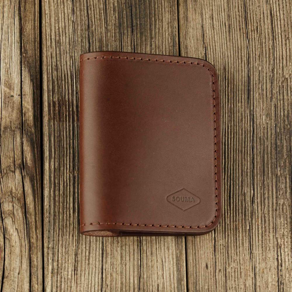 Brown leather bifold wallet with slot on Apple AirTag slot front view