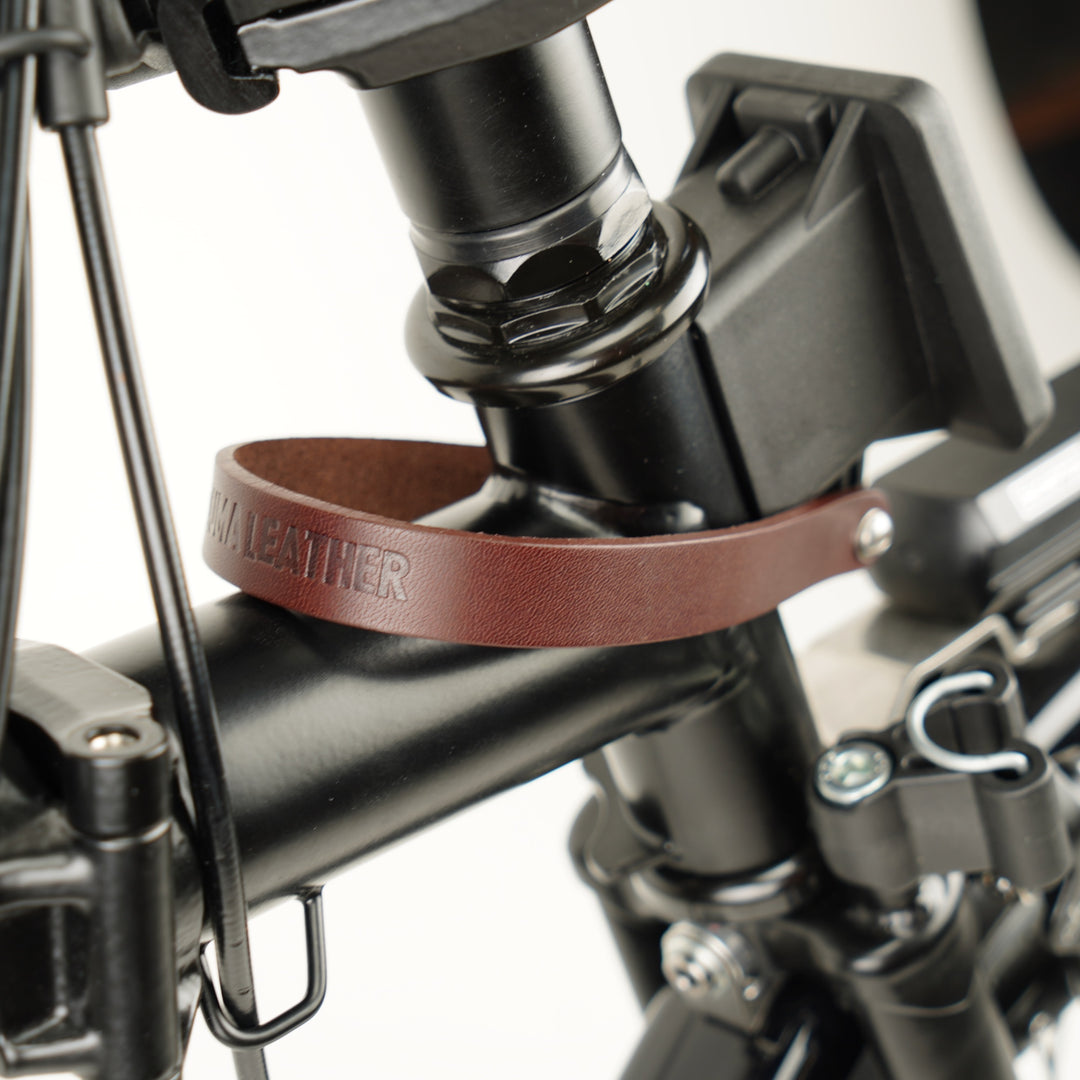 Leather Front Carrier Strap for Brompton bag brown close-up with logo