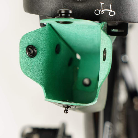 Green bicycle saddle bag with black hardware inside view