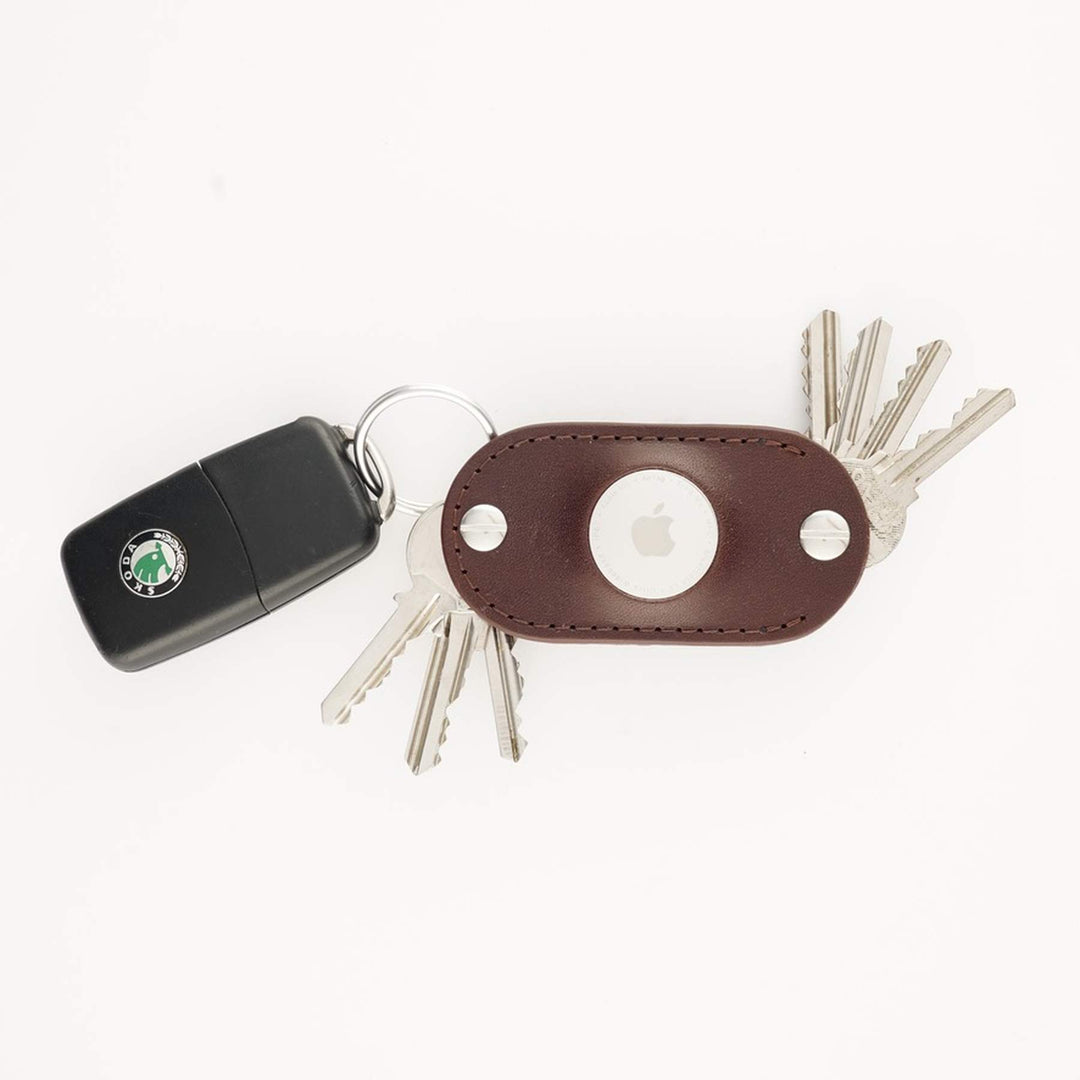 Brown leather AirTag key organizer with car key