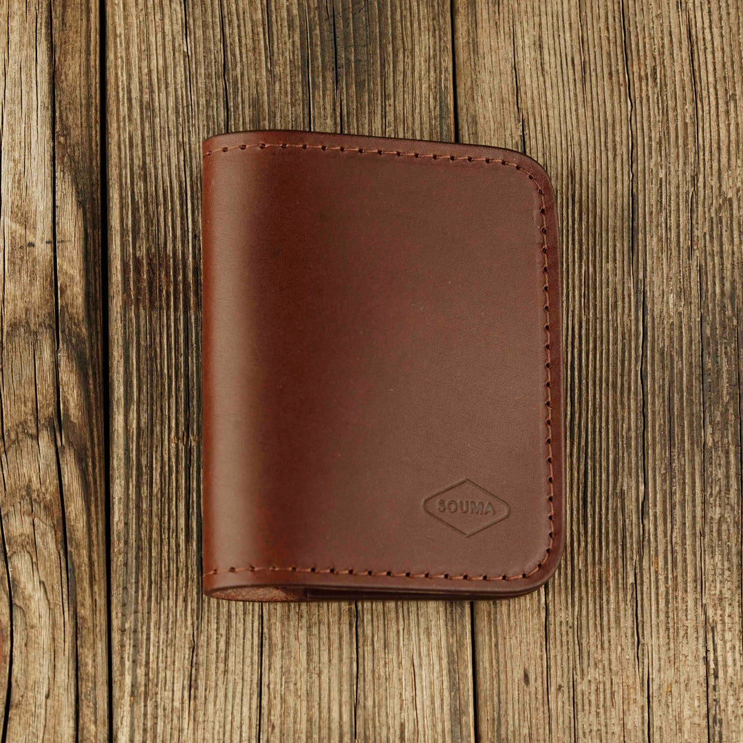 Bifold Apple AirTag Leather Wallet Brown wooden background