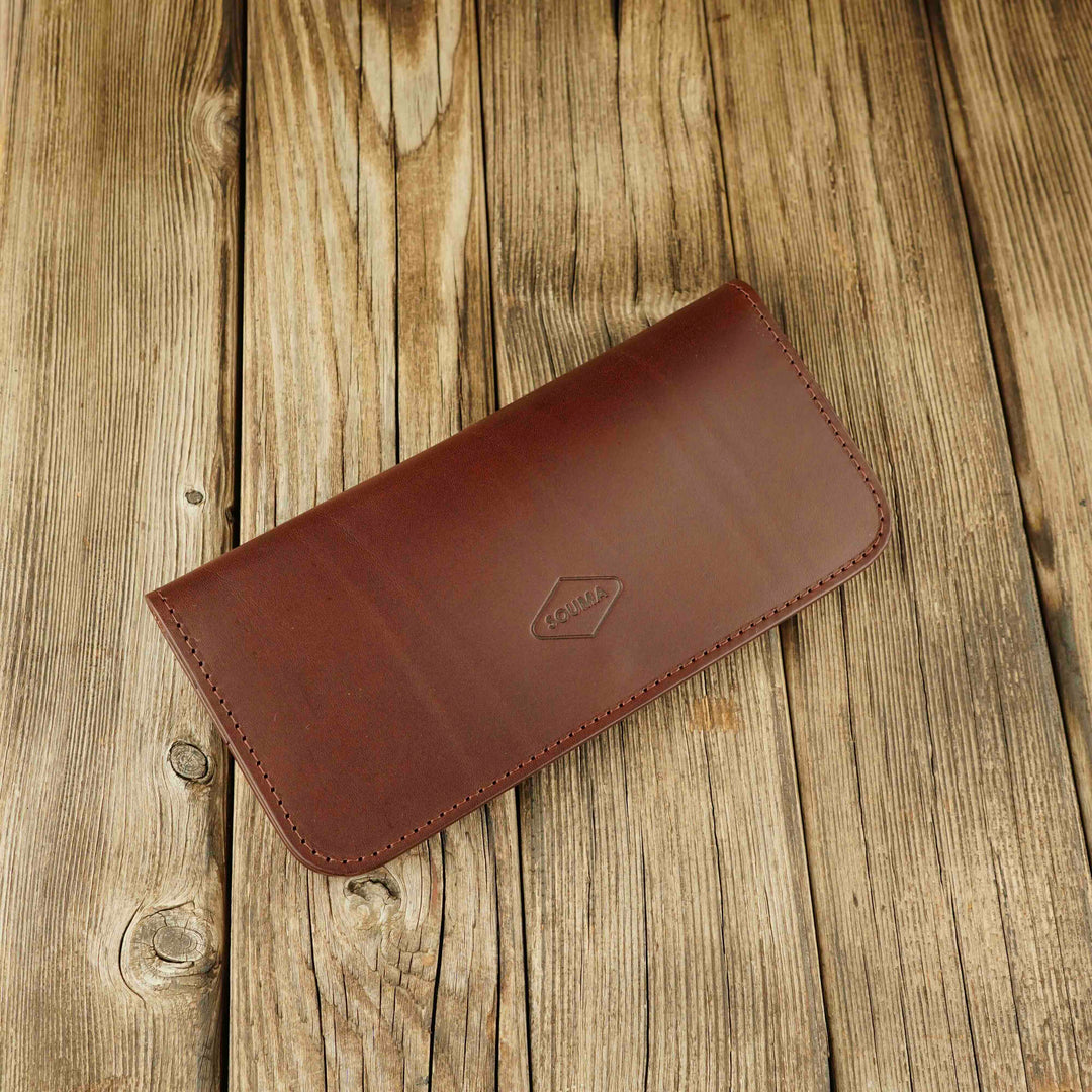 Women's Leather Wallet - Fold Souma Leather Brown, wooden background, closed 