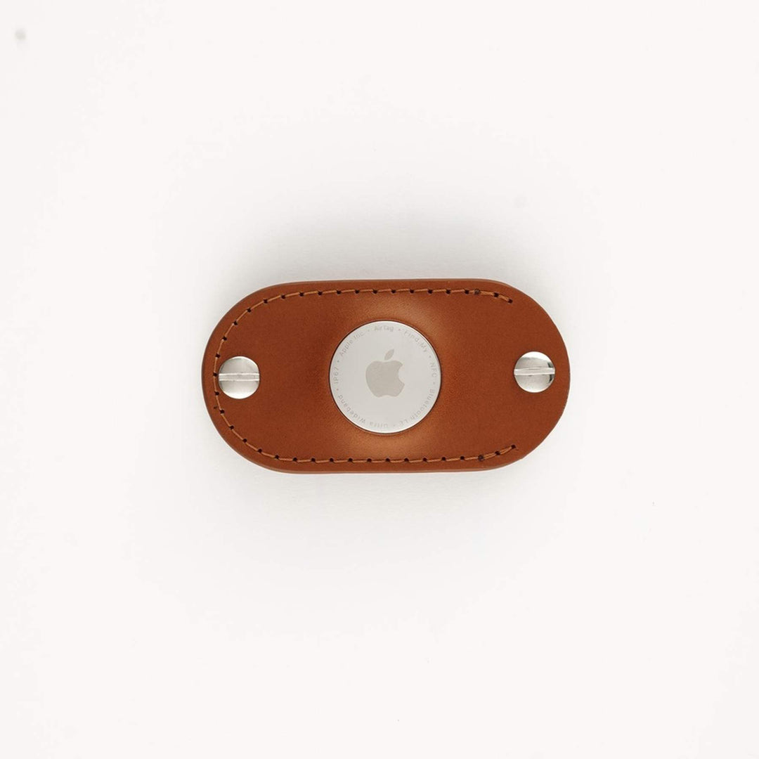 Honey leather AirTag key organizer white background