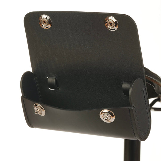 Black leather bicycle saddle bag with silver buttons open